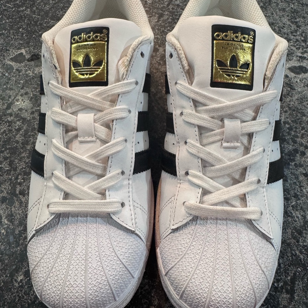 Adidas Women’s White Sneakers with Black Stripes